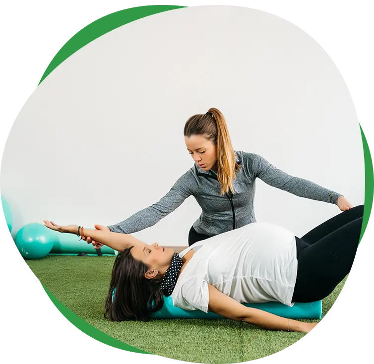 Therapist helping a patient manage chronic pain through therapeutic exercises.